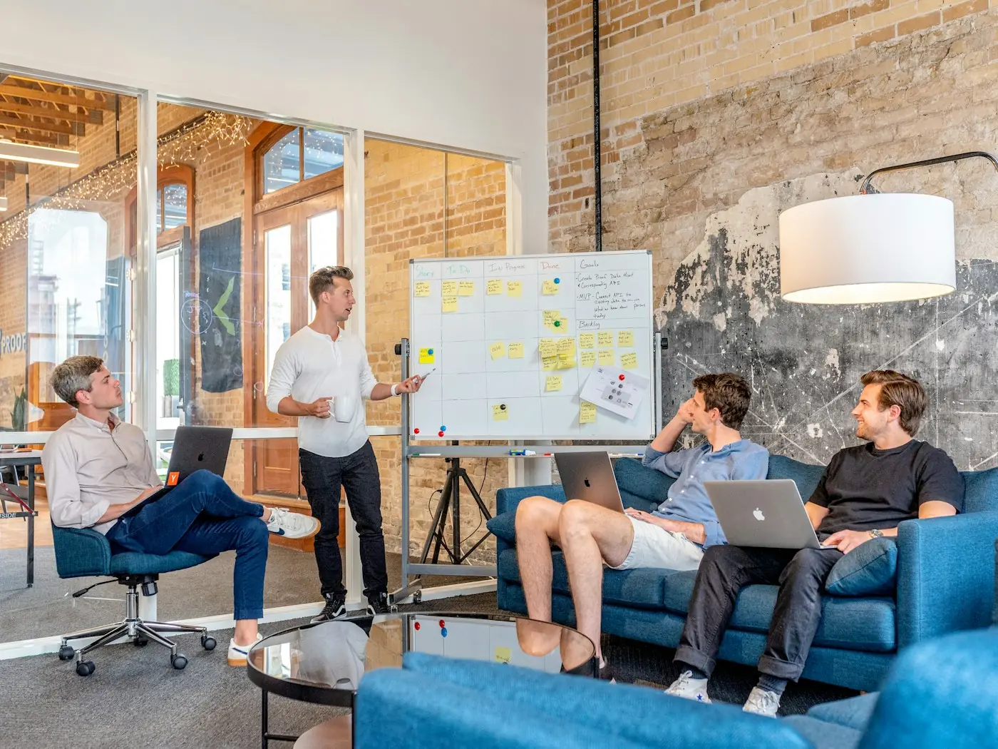 Team reviewing a plan on a whiteboard